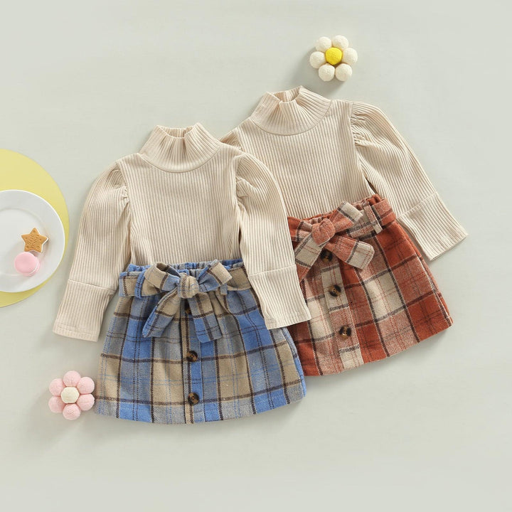 مجموعة ملابس للاطفال  لفصل الخريف منقسمة الى بلوزة عالي الرقبة وتنورة مضلعة منقوشة - متجر بيوتي سنتر