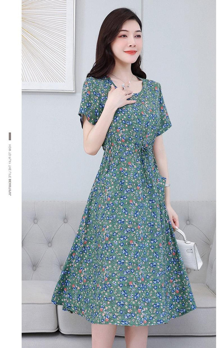 فستان صيفي للنساء بطباعة أزهار واكمام قصيرة بمقاسات واسعة - متجر بيوتي سنتر